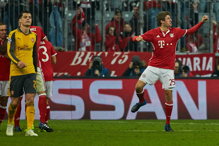 Thomas Muller pictured (right) celebrating after scoring a goal for Bayern Munich in a 5-1 win over Arsenal in February 2017